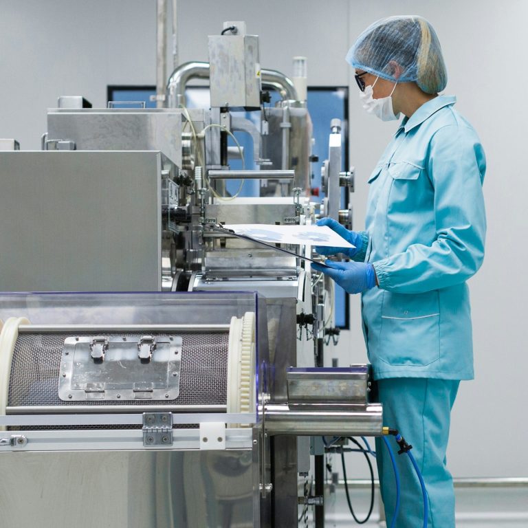 Operating a machine Image shows a person operating a machine.